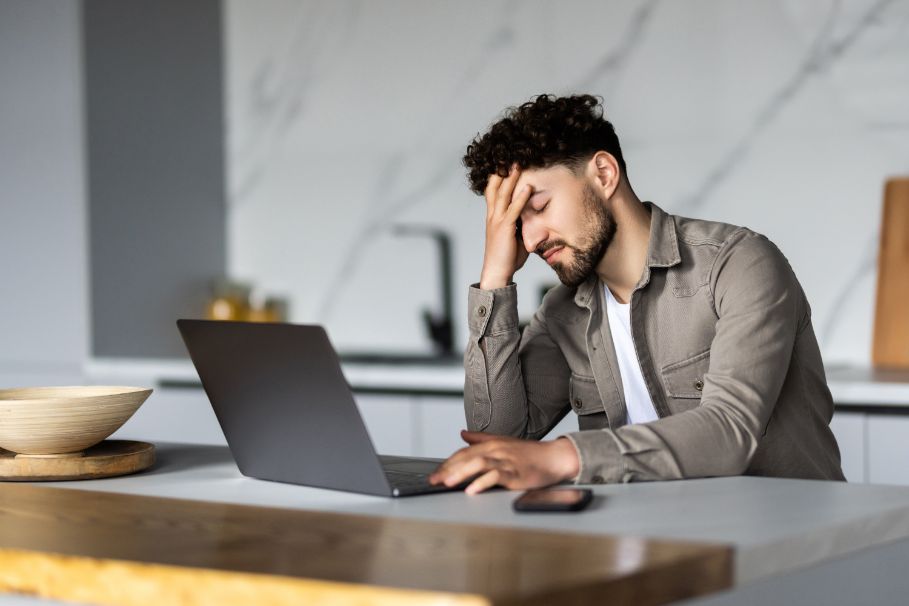 Image of frustrated person maintaining a website